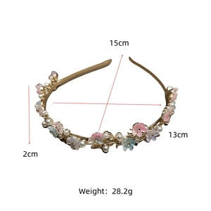 Detailed view of fairy style pearl headband with floral design and dimensions