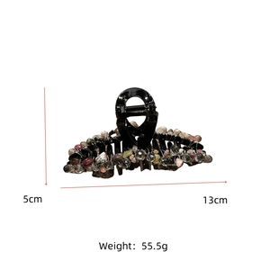 Détail d'une pince à cheveux de 13cm avec pierres de cristal, poids de 55,5g