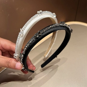Close-up of luxury French vintage crystal headbands with satin fabric and sparkling beads