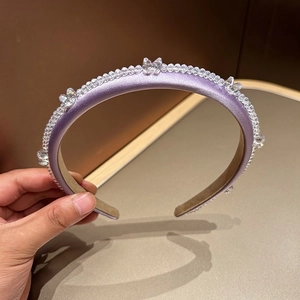Detail of purple satin headband with crystal butterfly beads and anti-slip lining