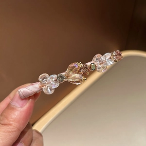 Elegant crystal hair clip with handmade pink ribbon wrapping and sparkling floral design