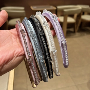 Five assorted colors of French retro crystal headbands with padded velvet and bead decor