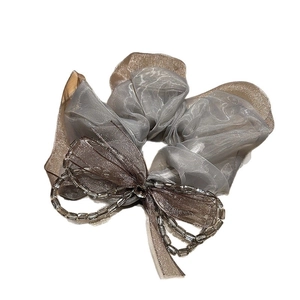 Elegant organza scrunchie in grey and champagne with crystal bow and beaded tassels