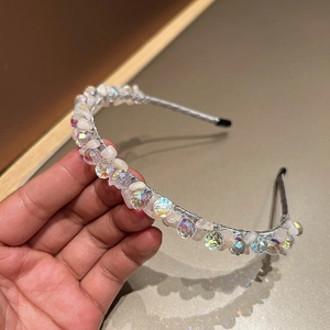 Detail of handcrafted silver wire headband with sparkling crystal beads and pink stones