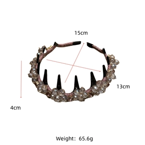 Detail of crystal flower headband with purple fabric wrap and functional inner comb teeth