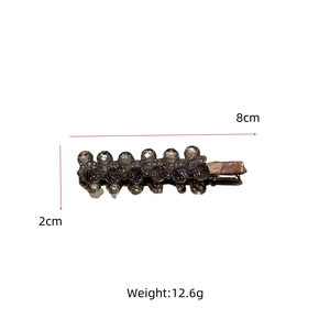 Detail view of crystal beaded duckbill hair clip with dimensions 8cm by 2cm and weight 12.6g