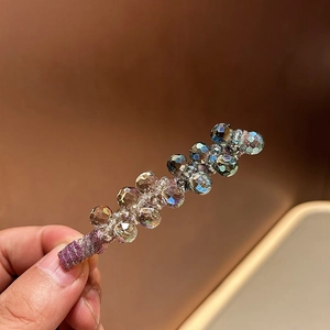 Elegant handcrafted crystal bead hair clip with iridescent shine and purple fabric wrap