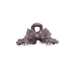 Elegant lavender crystal bow hair claw clip for women featuring a large shark grip design