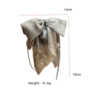Detailed size view of silver bow hair clip with crystal pendant and 18cm ribbon length