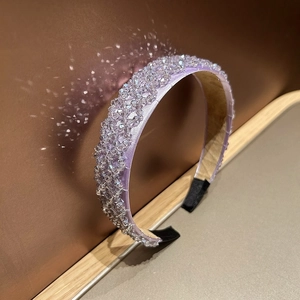 Detail of purple crystal beaded headband featuring sparkling handwoven sequins on silk