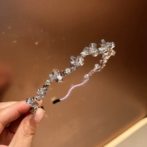 Macro shot of elegant hairband featuring faceted crystals and colorful rhinestones