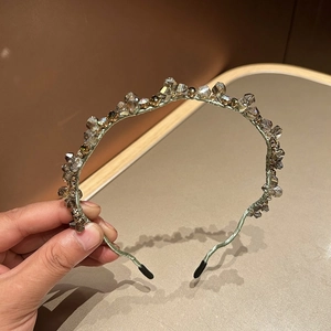 Elegant thin metal headband featuring champagne crystal beads and soft black end tips