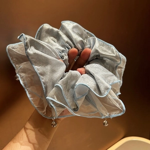 Elegant light blue lace scrunchie with crystal pendant and metallic mesh texture