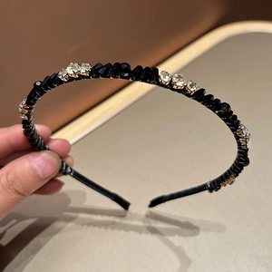 Detail view of crystal rhinestone headband with elegant hand-wrapped sparkling stones