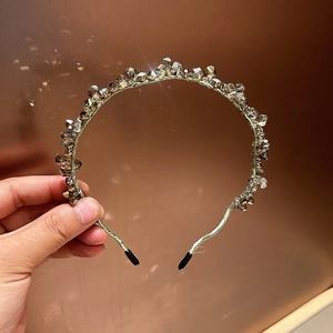 Detailed view of handmade forest-style headband with coffee crystal beads and soft ribbon