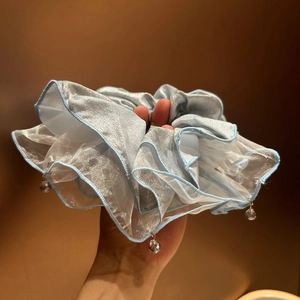 Elegant light blue organza scrunchie with crystal pendants and tiered lace design