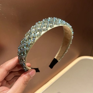 Detail of hand-woven crystal beaded wide headband with gray iridescent beads in diamond grid