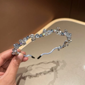 Close-up of light blue crystal beaded headband with multi-faceted diamond cut stones