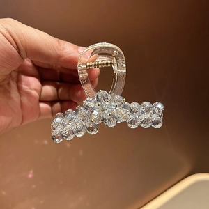 Elegant rhinestone hair claw clip with transparent crystal beads and floral design for women
