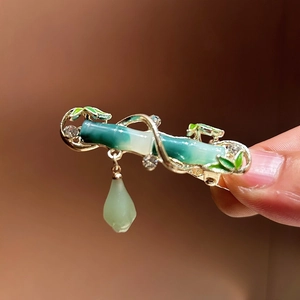 Traditional Chinese style bamboo hair clip with green enamel finish and pearl tassel detail
