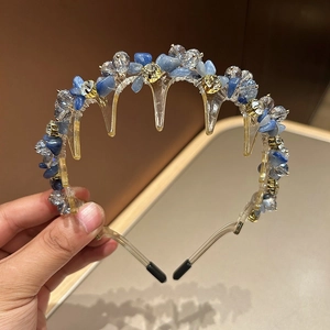 Elegant crystal hair hoop with blue stones and gold metal base for women's hairstyle