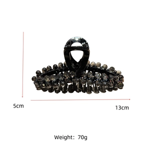 Detail view of large black hair claw clip with crystal beads and dimensions 5cm by 13cm