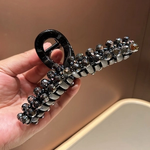 Elegant large black hair claw clip with shimmering dark grey crystals for thick hair