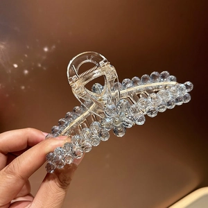 Elegant crystal shark hair claw clip with blue faceted beads and gold metal springs