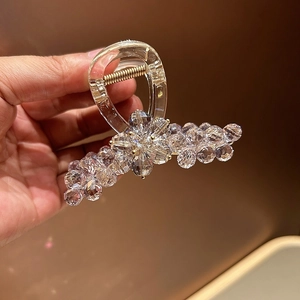 Elegant acrylic hair claw clip with clear floral rhinestones and gold metal spring