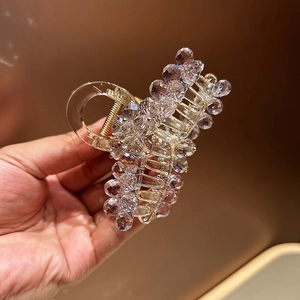 Elegant lavender crystal hair claw clip with rhinestones and gold spring for women