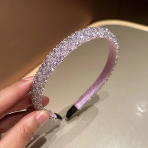 Macro shot of handcrafted lavender crystal beaded headband with luxury woven texture