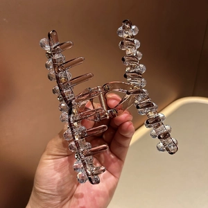 Grande pince à cheveux en cristal avec base ambrée et perles à facettes brillantes