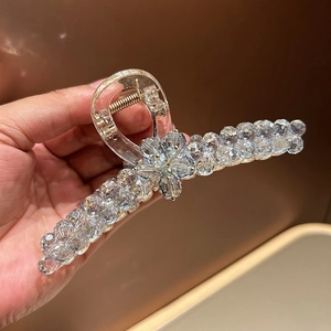 Elegant large crystal hair claw clip with floral rhinestone design and gold spring