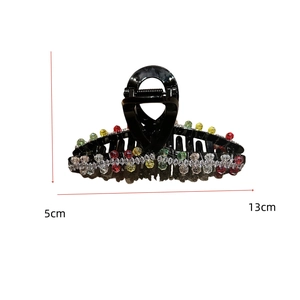 Detailed view of hair claw clip with colorful crystal beads and 13cm length measurement