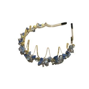 Luxurious crystal headband with blue crushed stones and non-slip comb teeth on white base