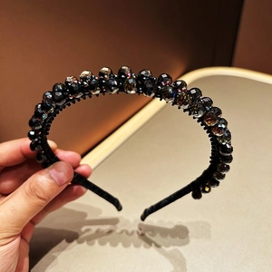 Close-up of handmade double-layered black crystal headband with faceted beads