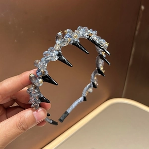 Elegant crystal headband with light blue beads and metal flower details on hair comb