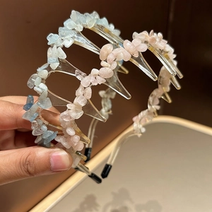 Detail of non-slip hairbands with natural blue and pink stones and long comb teeth