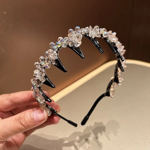 Detailed close-up of crystal beaded headband with anti-slip comb teeth design