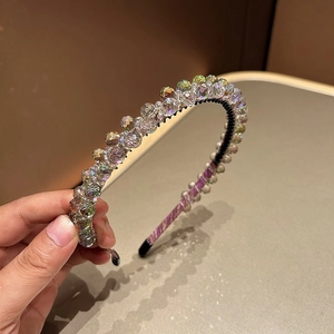 Close-up of double-layer crystal headband showing detailed beads and non-slip inner teeth
