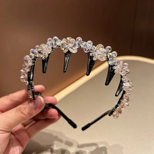 Detail view of the colorful crystal beads and non-slip comb teeth on the black hairband