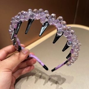 Elegant luxury crystal beaded headband with purple faceted gems and black comb teeth design