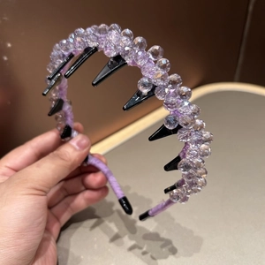 Detail of purple crystal beaded headband featuring anti-slip inner comb teeth for secure fit