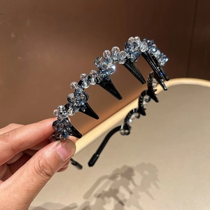 Detail of crystal headband showing navy and clear beads with non-slip tooth comb