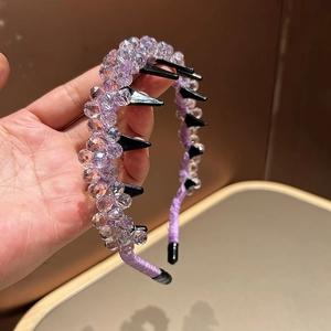 Detail of purple crystal beaded headband with non-slip comb teeth and glossy finish