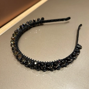 Detail of black and amber multi-faceted crystals on elegant double-layer headband