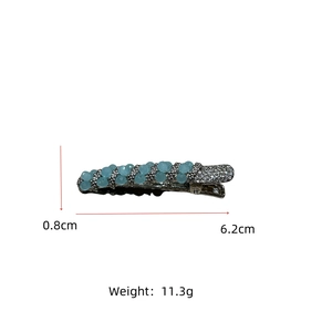 Detail view of crystal hair clip showing 6.2cm length and light blue faceted beads