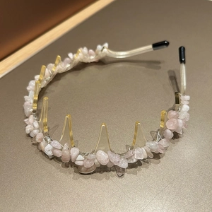 Detail of pink stone headband with non-slip teeth and amber acrylic base for women
