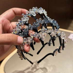 Macro shot of non-slip hairbands featuring crystal flower beading and fine inner teeth