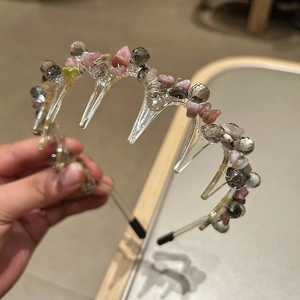 Detail of bohemian headband with colorful natural stones and non-slip wavy teeth